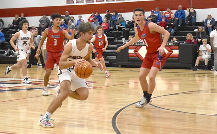 Fletcher Dubas dribbles past an opponent. NCJ photo by Beth Sparrow