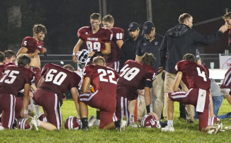 Fullerton held on for a 32-24 win over Palmer on a wet Friday night. NCJ photo by Cathy Cook