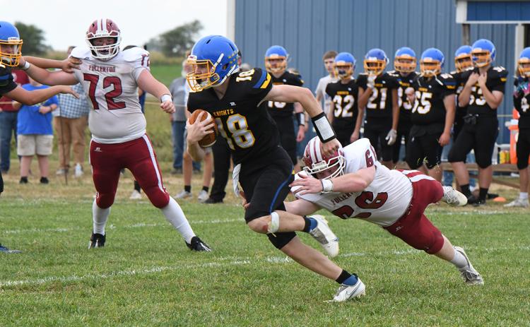 Aidan Bittner makes a diving grab for Nebraska Lutheran quarterback Isaac Beiermann. Bittner finished with 2 tackles in the game. NCJ photo by Rick Holtz