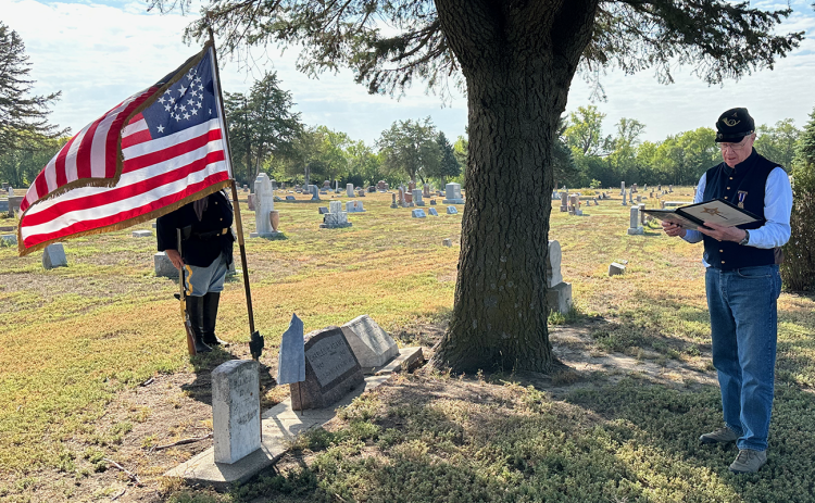 Norm Webber leads the ceremony to mark the grave of the last Union Civil War soldier buried in Nance County. Charles H. Adams died Aug. 23, 1940 and he is buried in the Fullerton Cemetery. NCJ photo by Rick Holtz