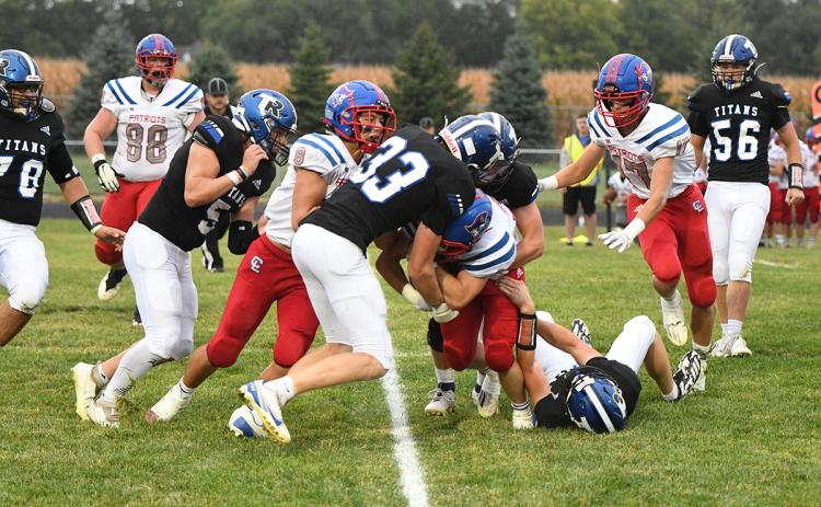 Kirk Hebda stops the Clarkson/Leigh ball carrier in the first quarter on Friday. Hebda finished with a game-high 19 tackles for the Titans. NCJ photo by Rick Holtz