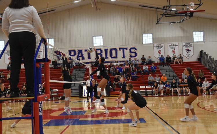 Chloe Pilakowski goes on the attack as the rest of the Titans move into position. NCJ photo by Beth Sparrow