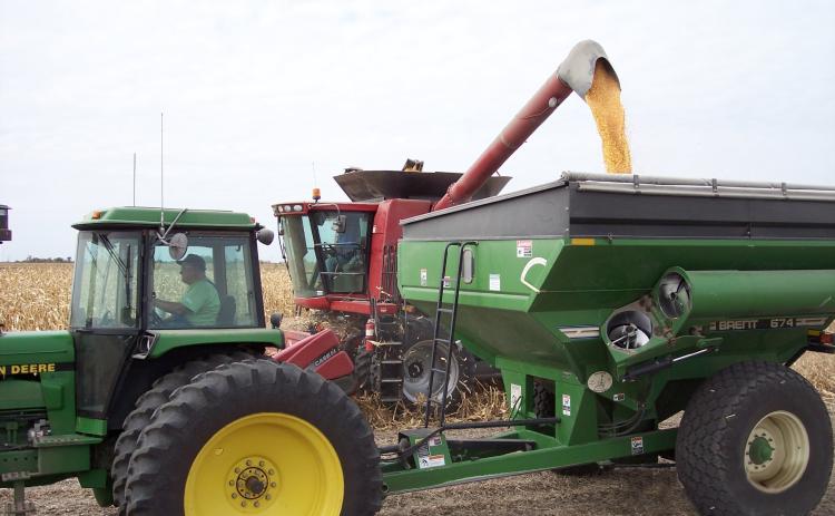 Mike McCray and his late father, Clifford, harvest together in 2010. He said harvesting has changed over the years. Photo provided