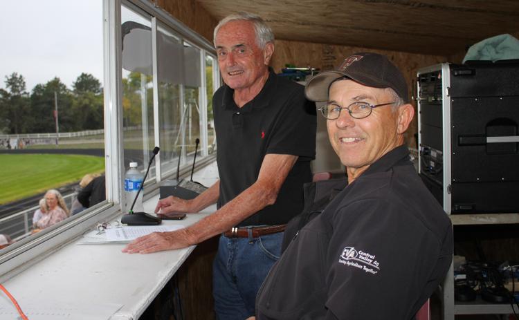 John Morgan (standing) announces football games every  Friday with his spotter, Randy Cox. NCJ photo by April Carr