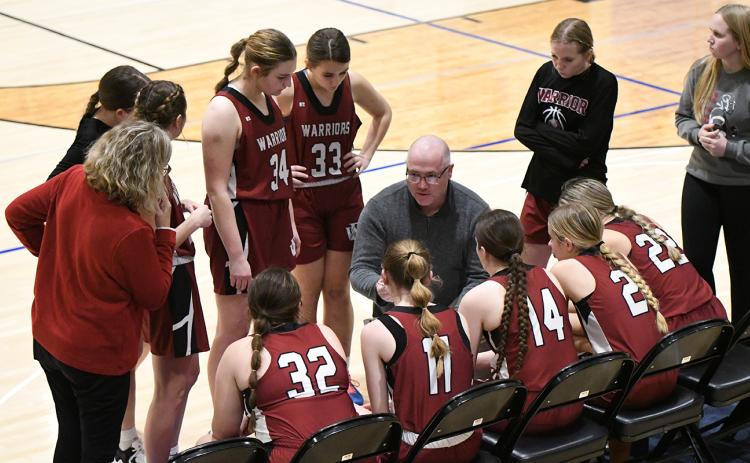 Fullerton coach Jason Maxfield talks things over with the Warriors during a timeout in one of the three overtimes on Thursday. NCJ photos by Rick Holtz