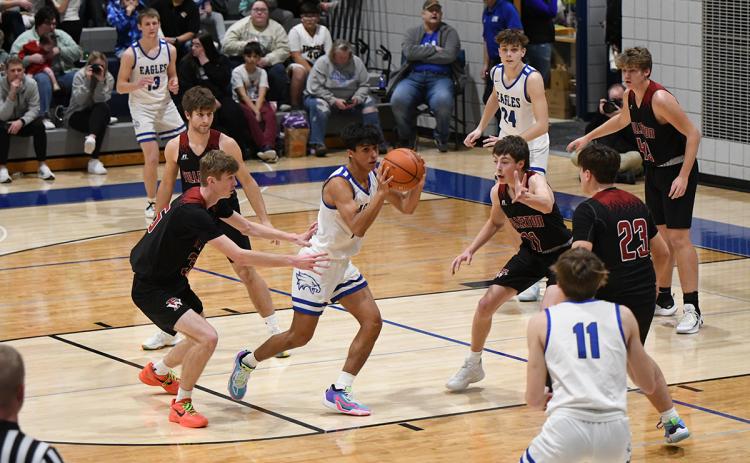 The Warrior defense collapses on the ball handler last week when Fullerton played Lutheran-Northeast. NCJ photo by Rick Holtz
