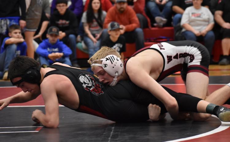 Tate Wood looks for an opening in the district meet. NCJ photo by Melissa Aaberg