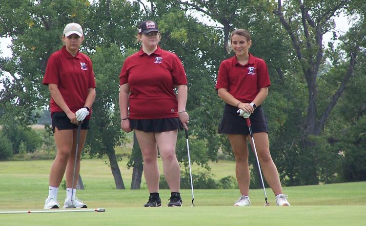 The Warriors’ team of Lylla Sabata (left), Kinzie Sharman and Keila Dubas finished six strokes off the leaders with a 76. Photo provided