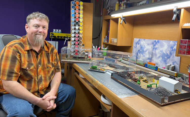 Allen Zimmerman displays some of the scenes he has created forAllen’s N Scale World. NCJ photos by Rick Holtz
