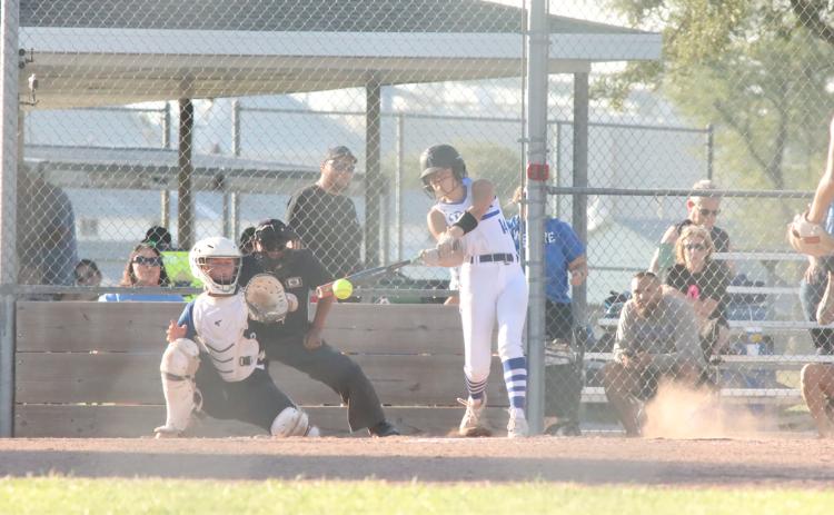 Adalyn Bishop drives the ball for an RBI single in the Titans win over the GACC Bluejays. NCJ photo by Ken Kush