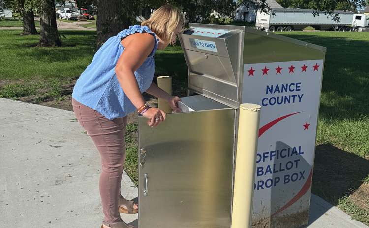 Nance County Clerk Adrian Chlopek checks the drop box in the back of the courthouse for last minute ballots on Tuesday evening. NCJ photo by Rick Holtz