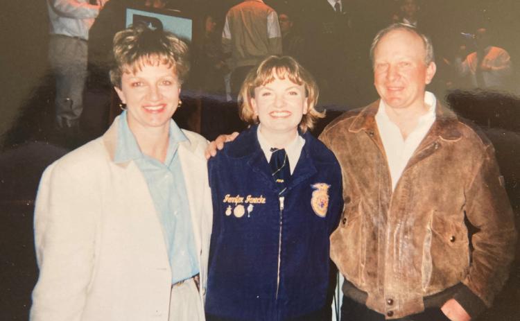 JENNIFER WOOD (JARECKE) stands with her parents, Dennis &amp; Julie Jarecke, after becoming an FFA State Officer nearly 26 years ago. The officer team was celebrated last year at the FFA State Convention in Lincoln for the 25th anniversary of their time serving as State Officers. Photo courtesy of Jennifer Wood.