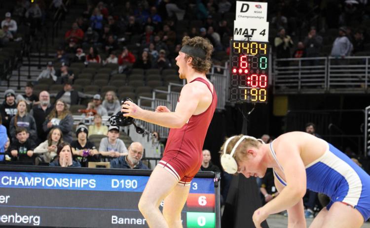 Fullerton senior Brett Bridger celebrates after defeating Banner County’s Wyatt Reichenberg to win a state title. NCJ photo by Travis Lane