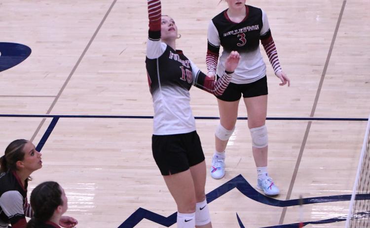Jaci Maxfield goes on the attack for the Warriors. The senior finished with 7 kills on Thursday. NCJ photo by Rick Holtz