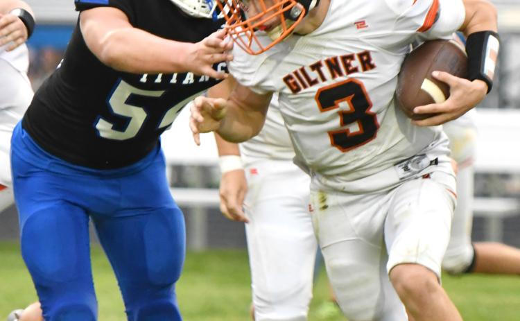 Alex Konwinski pressures the Giltner quarterback early in Friday’s game. The Twin River freshman recorded a sack on the play. NCJ photo by Rick Holtz