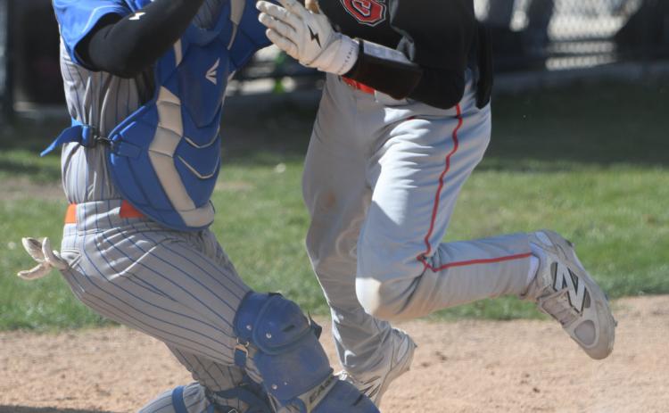 Titan catcher Aden Feezell makes the play at home to save a run on Thursday. NCJ photo by Rick Holtz
