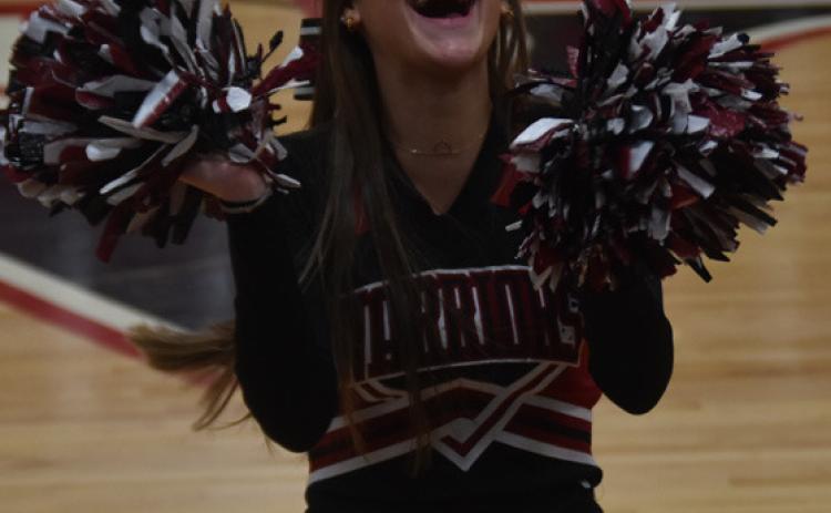 Pictured above is Taylor Anderson, with her supportive smile cheering on the boys and girls Friday night at home against Heartland Community. Taylor is a senior in highschool, captain of the cheer team. She has been a cheerleader for all four years at FHS. After graduation Taylor plans to attend Wayne State going into Pre-med. Photo by Zoe Wetovick