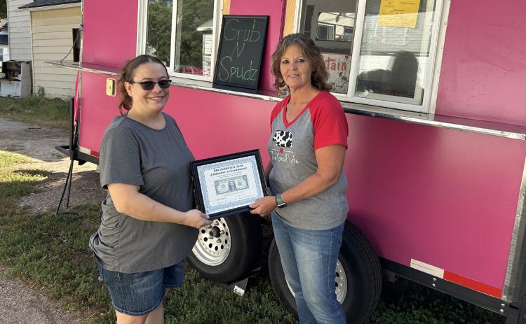 The Fullerton Area Chamber of Commerce welcomes Grub N Spudz to the community. Brittney Province said she started her business back in July. Brittney (left) is presented with a Dollar Award. Photo provided