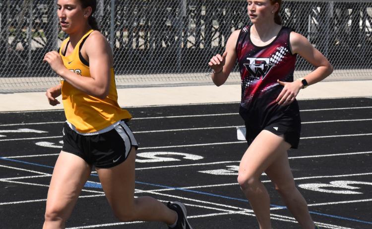 Warriors, Titans Head to District Track
