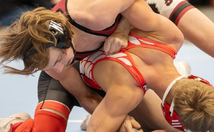 Pictured above: Ethan Hoback earning a third place medal