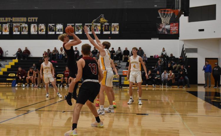 Pictured above: Tyler Gochenour putting up the shot for 2 pts. Picture by Beth Sparrow