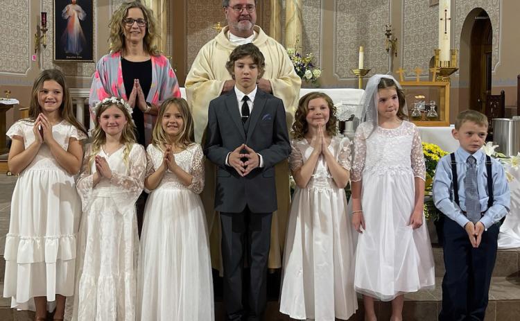 St. Peter’s Catholic Church recently celebrated First Communion. Top row: Jennifer Dubas, Father Bill Lheureux Bottom Row left to right: Alessandra Small, Blakely Boryca, Lemon Small, Cole Small, Payton Zierke, Penelope Strnad, Sawyer Russell. Photo provided