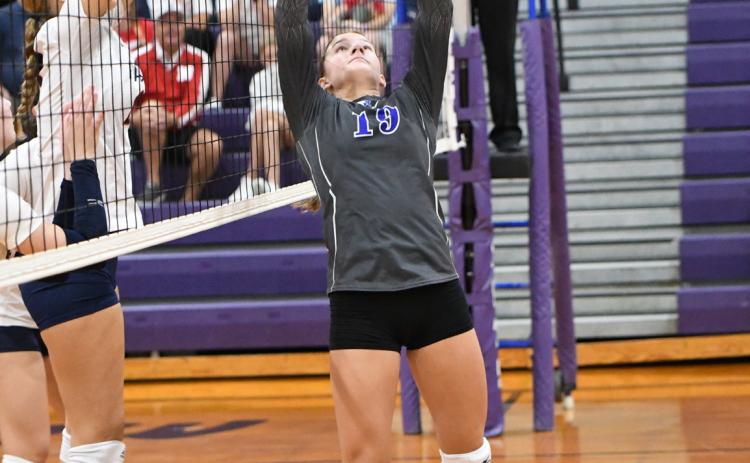 Callie Held sets the ball for the Titans against Adams Central. NCJ photo by Rick Holtz