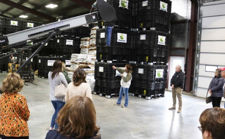 Owner of Maple Creek Seeds, Rachel Sindelar (middle) shows guest her seed warehouse, which was constructed in 2015. Photo provided