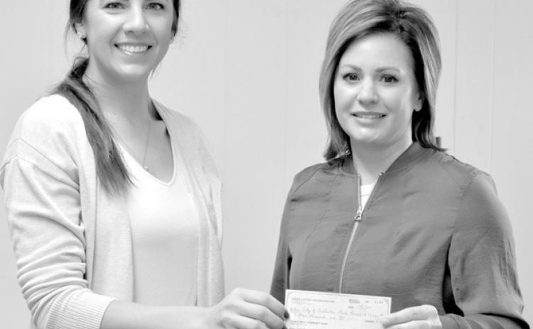 Fullerton Park Board member Brittany Santin (left) accepts a $15,000 check from Nance County Foundation representative Missy Crouse for the Fullerton City Park Equipment Campaign. The Foundation’s generous donation will be displayed on the donor wall after completion. Journal photo
