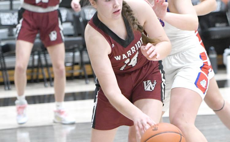 Georgia Bridger looks to find an open teammate in the paint against Humphrey-Lindsay. NCJ photo by Rick Holtz