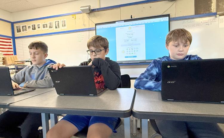 Brecken Vetick, Emmett Zarek and Nolan Shanle are just three of the Twin River students who answers questions in their free time through freerice.com. The district has answered more than 100,000 questions correctly. NCJ photos by Rick Holtz