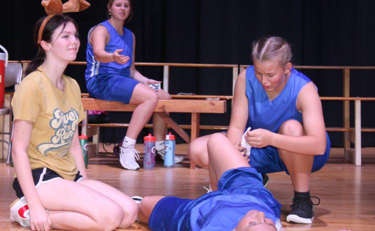 Rainna Sierks channels her inner “Air Bud” in an attempt to impress the coach and players.NCJ photo byApril Carr