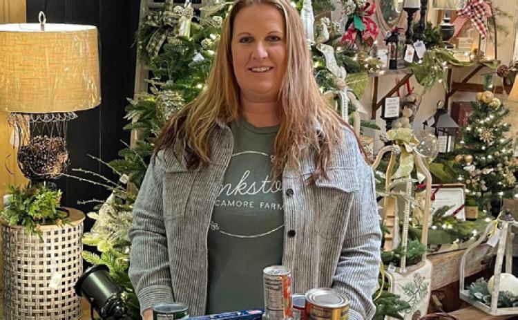 The Flower Barrel also participated in the Caring Rose Week was Nov 8-13. Donate 2 cans of food and receive a dozen roses for $10 dollars. Terri Larson picked up all the food to go to the food pantry. I sold out of roses so I thought that was super awesome. Pictured on left