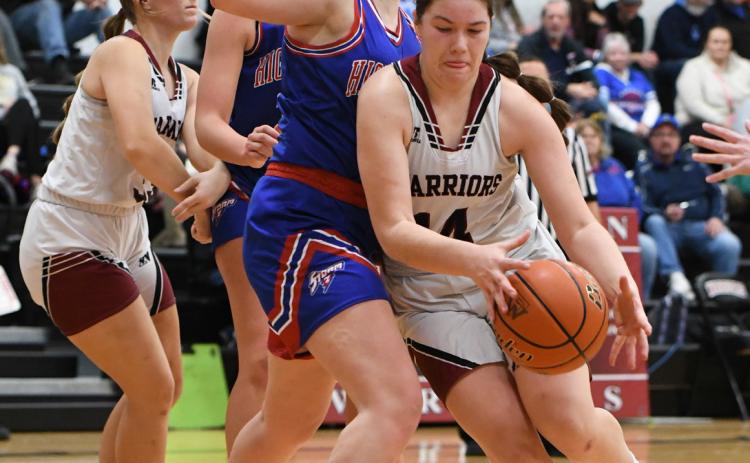 Georgia Bridger makes a strong move in the post against the bigger High Plains defender. NCJ photo by Rick Holtz