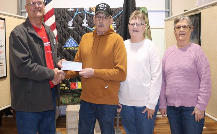 Cornhusker Public Power District Trustee Marc Swantek (left) presents $200 to Nance County Veterans Memorial and Resource Center for concrete. Accepting the check (left to right) are Board Chair Jon Epley and volunteers DeeAnn Epley and Nadine Imus.
