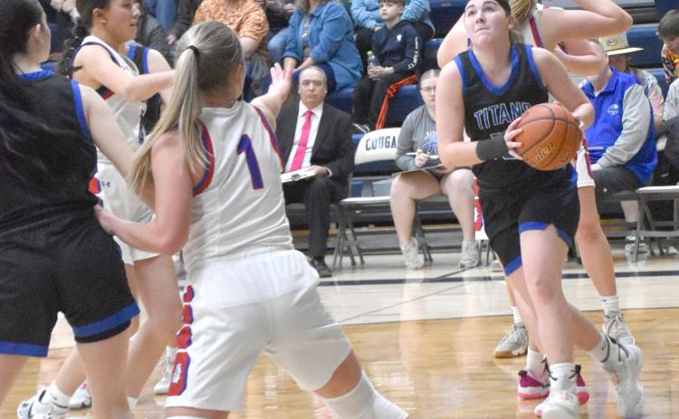 Delaney Reeg drives to the basket on Monday against Humphrey/Lindsay Holy Family. The Twin River senior finished with a team-high 19 points. NCJ photo by Beth Sparrow