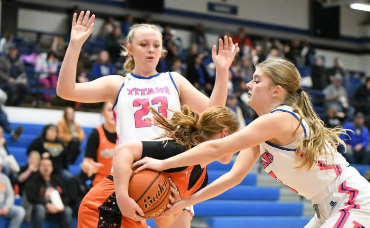 Mya Ramaekers (left) and Parker Zabka apply pressure on the Giltner ballhandler during the first half on Friday. NCJ photos by Rick Holtz