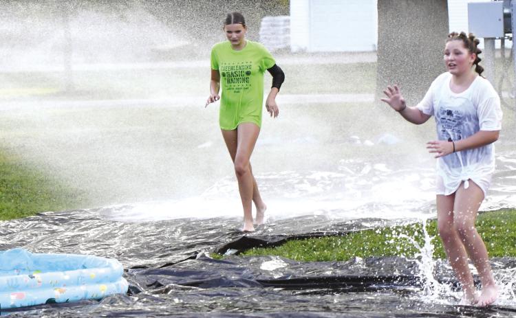 Twin River FCCLA sponsored slip ‘n slide kickball at Pawnee Days last week. The games were separated into a boys game and a girls game. The games drew about 20 kids out to play. NCJ photo by Rick Holtz