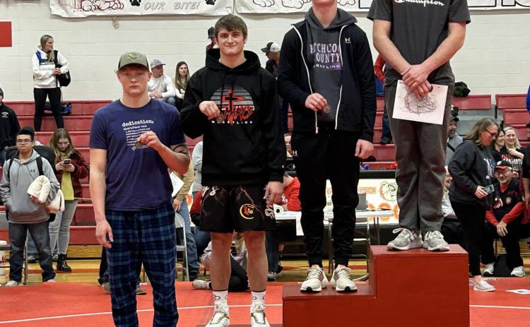 Standing on the top of the podium receiving the First Place hardware is Brett Bridger with a 7-0 record