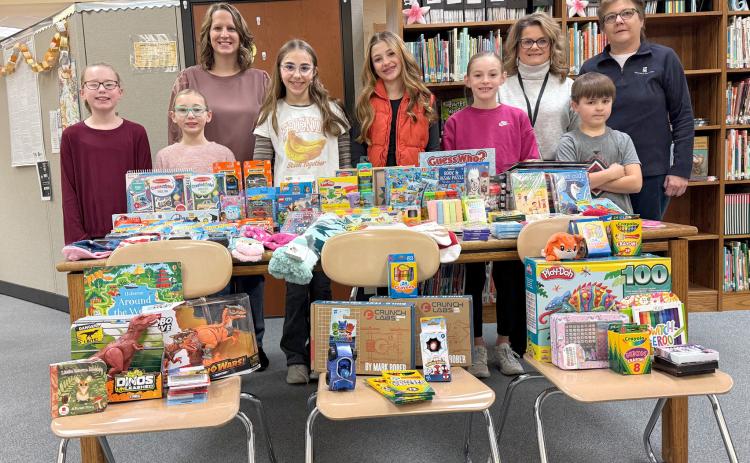 Fullerton students donated toys to Boone County Health Center. Paisley Jazwick (left), Grace Crouse, Miranda Jazwick, Rayna Hamik, Carly Malander, Molly Dubas, Melissa Aaberg, Jett Malander, Cindy Lesiak. NCJ photo by Rick Holtz