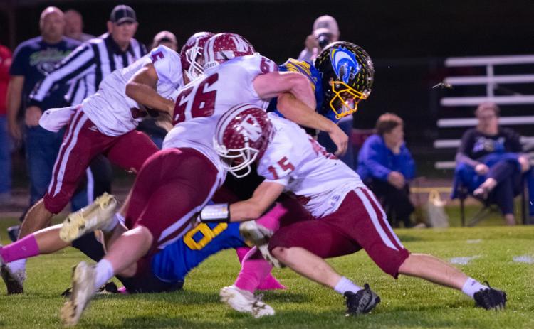 Aidan Bittner and Landen Glup make the stop for the Warriors. NCJ photo by Melissa Aaberg