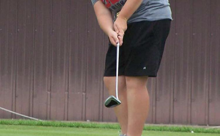 Tierney Russell putts on hole No. 3 on her way to leading the team with a 47 and a 2nd place finish in the dual. Photo provided