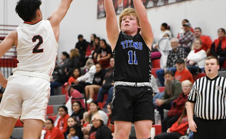 Paydon Rinkol fires from long-range in the first half on Saturday against Madison. NCJ photo by Rick Holtz