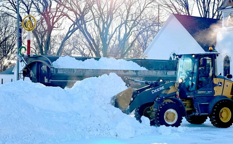Crews worked Tuesday morning to remove piles of snow from Broadway in Fullerton. Nance County was hit with a second round of snow last week that closed schools on Friday and Monday. NCJ photos by Rick Holtz