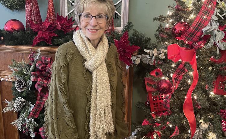 Deb Bittner stands in her shop. NCJ photo by April Carr