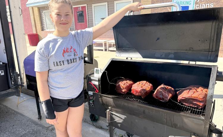 Dayzie-Kay Olson with Easy Bake BBQ won the People’s Choice Award on Saturday at Fullerton’s Fall Festival. The 12-year-old pitmaster was the youngest contestant in the BBQ Cookoff. NCJ photos by Rick Holtz