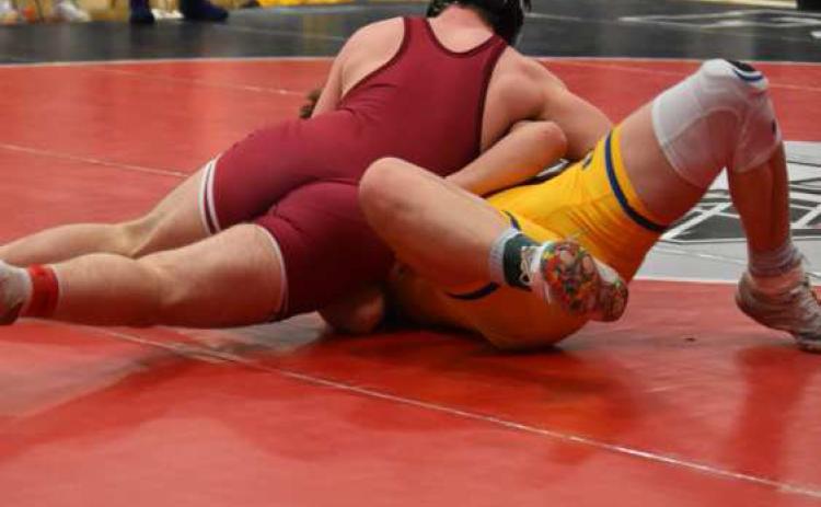 BRETT BRIDGER pins his opponent, Coy Vrbka of Shelby-Rising City