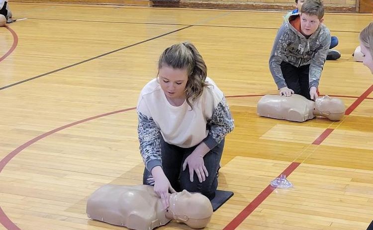 KIERA BREMER and her classmates learn where to check a pulse when it comes to CPR.