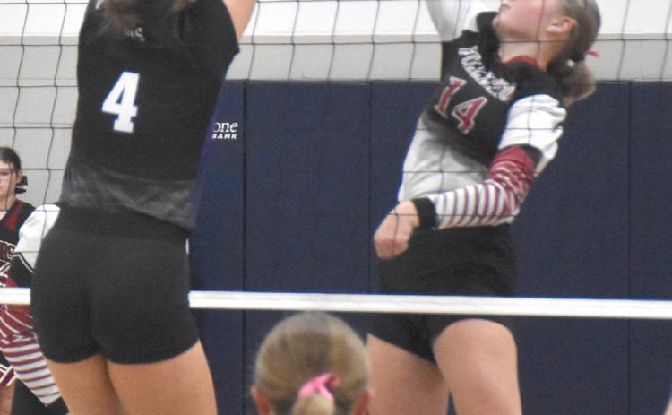 Kaycee Harter had 7 kills for the Warriors in their conference opener against Burwell. NCJ photo by Beth Sparrow.