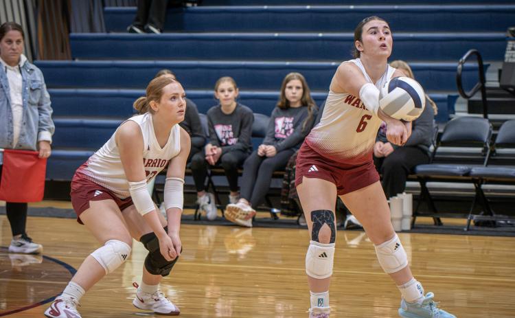 Ava Smith keeps the rally going for the Warriors on Thursday against Burwell. NCJ photo by Rick Holtz